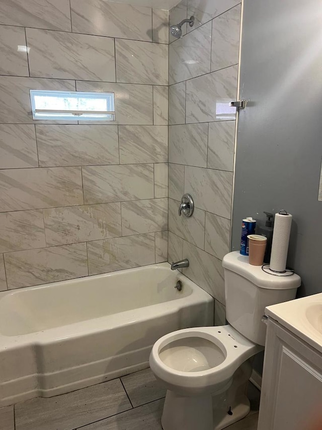 14027 S Mackinaw Ave, Burnham, IL 60633 - bathroom featuring toilet, shower / bathtub combination, vanity, and wood finished floors