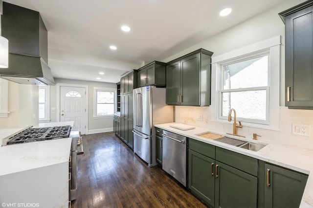 605 Home Ave, Oak Park, IL 60304 - kitchen featuring stainless steel appliances, a sink, green cabinets, dark wood-style floors, and ventilation hood