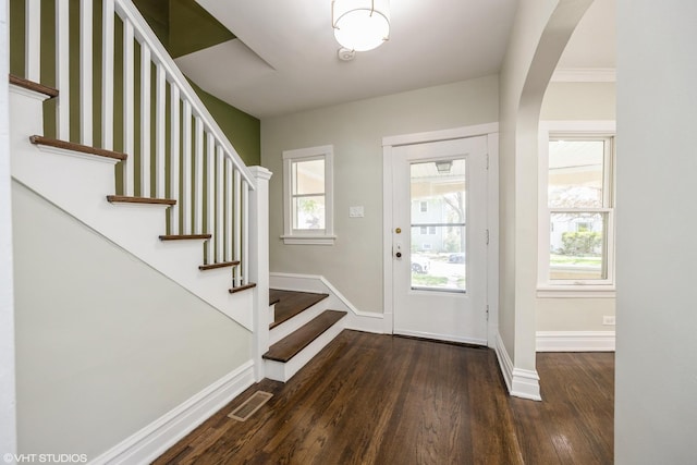 605 Home Ave, Oak Park, IL 60304 - entryway with dark wood-style floors, baseboards, stairs, and arched walkways