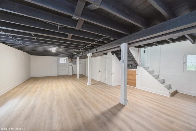 605 Home Ave, Oak Park, IL 60304 - basement featuring stairs, wood finished floors, and baseboards