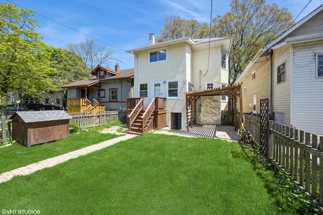 605 Home Ave, Oak Park, IL 60304 - back of house with stucco siding, a storage shed, a pergola, an outdoor structure, and a chimney
