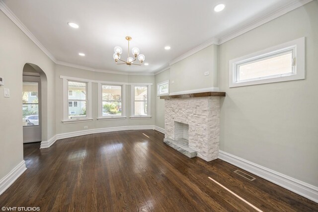 605 Home Ave, Oak Park, IL 60304 - unfurnished living room featuring baseboards, a stone fireplace, a chandelier, recessed lighting, and crown molding