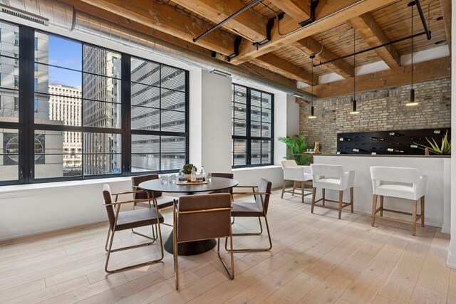 223 W Lake St Unit 3N, Chicago, IL 60606 - dining space featuring wooden ceiling, wood finished floors, and beamed ceiling