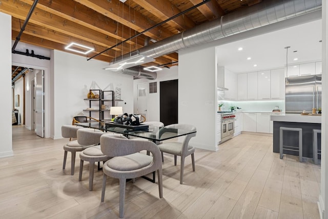 223 W Lake St Unit 3N, Chicago, IL 60606 - dining room with a barn door, light wood finished floors, recessed lighting, and baseboards