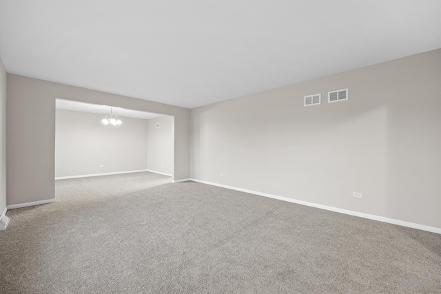 15252 Larkspur Ln, Orland Park, IL 60462 - empty room featuring carpet floors, baseboards, and a chandelier