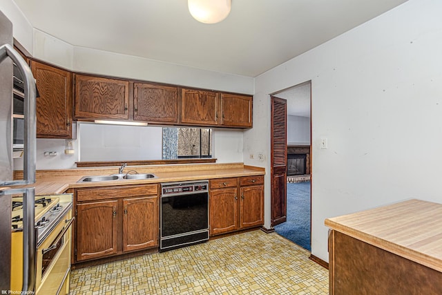 8245 Willow Dr Unit 43D, Palos Hills, IL 60465 - kitchen featuring dishwasher, a sink, light countertops, stove, and light floors