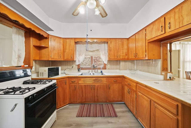 3132 Oak Park Ave, Berwyn, IL 60402 - kitchen featuring white appliances, a sink, open shelves, ceiling fan, and light wood-style floors