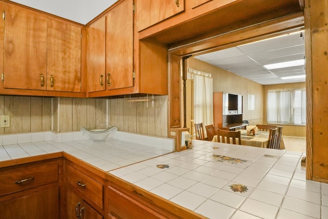 3132 Oak Park Ave, Berwyn, IL 60402 - kitchen featuring tile countertops and brown cabinetry