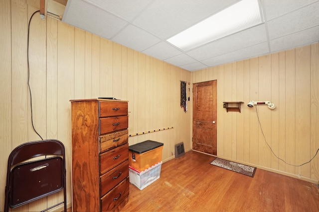 3132 Oak Park Ave, Berwyn, IL 60402 - unfurnished office featuring a drop ceiling, wood finished floors, baseboards, and wooden walls