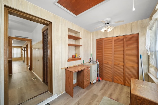 3132 Oak Park Ave, Berwyn, IL 60402 - hallway with light wood-type flooring and wood walls