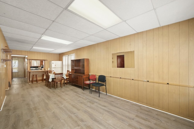 3132 Oak Park Ave, Berwyn, IL 60402 - living area with a paneled ceiling, wood finished floors, and wood walls