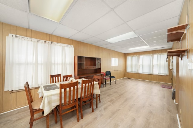 3132 Oak Park Ave, Berwyn, IL 60402 - dining room featuring a paneled ceiling, wood finished floors, and wooden walls