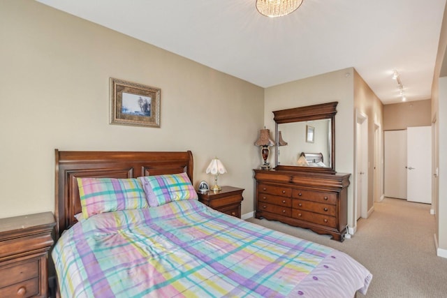 carpeted bedroom with baseboards