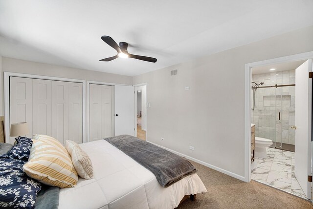 407 Meadow Ave, Frankfort, IL 60423 - bedroom featuring two closets, baseboards, ensuite bathroom, and a ceiling fan