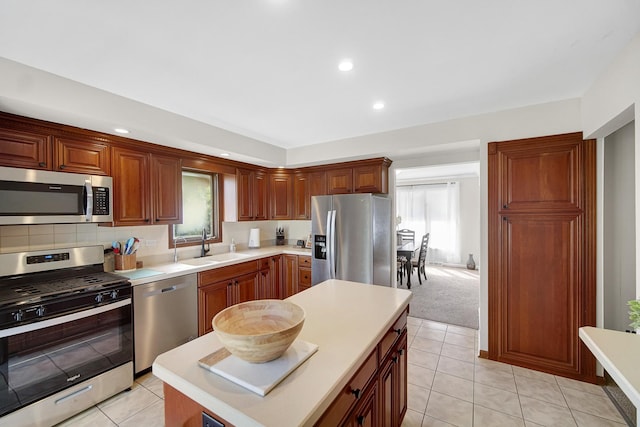 407 Meadow Ave, Frankfort, IL 60423 - kitchen featuring stainless steel appliances, a sink, light countertops, recessed lighting, and a center island