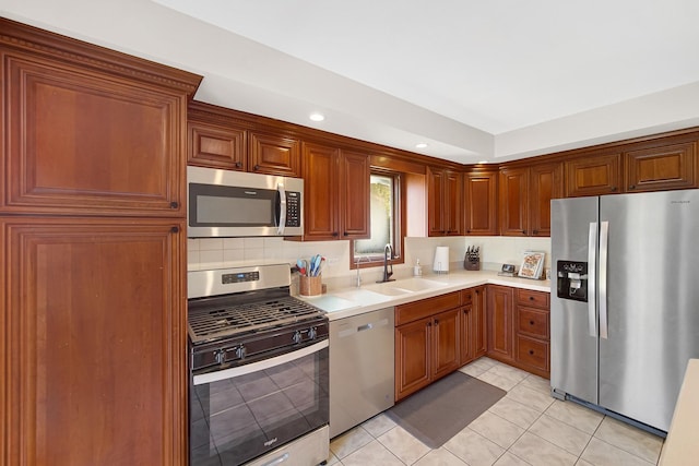 407 Meadow Ave, Frankfort, IL 60423 - kitchen featuring stainless steel appliances, light countertops, a sink, light tile patterned floors, and recessed lighting