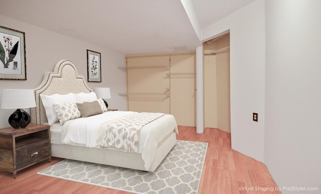 bedroom featuring light wood finished floors