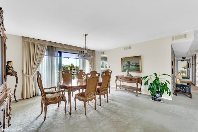 1535 Forest Ave Unit 504, River Forest, IL 60305 - dining room with light colored carpet, baseboards, and a chandelier