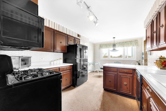 1535 Forest Ave Unit 504, River Forest, IL 60305 - kitchen with black appliances, light countertops, backsplash, and a peninsula