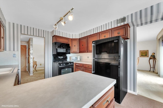 1535 Forest Ave Unit 504, River Forest, IL 60305 - kitchen featuring black appliances, wallpapered walls, light carpet, light countertops, and brown cabinets