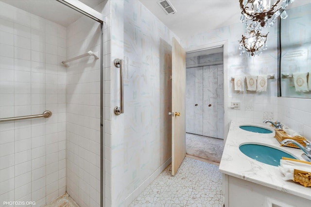 1535 Forest Ave Unit 504, River Forest, IL 60305 - bathroom with a stall shower, double vanity, and a chandelier