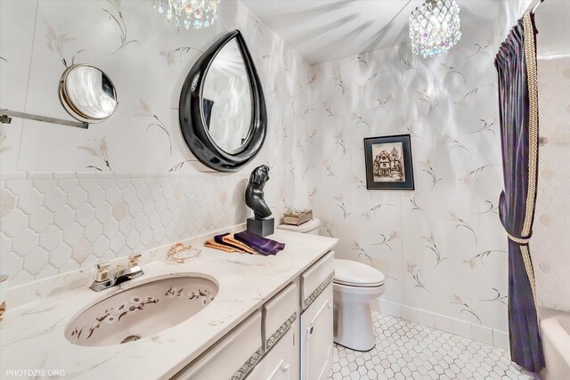 1535 Forest Ave Unit 504, River Forest, IL 60305 - full bathroom with vanity, toilet, and tile patterned flooring
