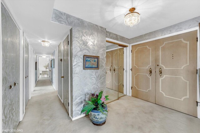 1535 Forest Ave Unit 504, River Forest, IL 60305 - carpeted foyer entrance with wallpapered walls and a chandelier