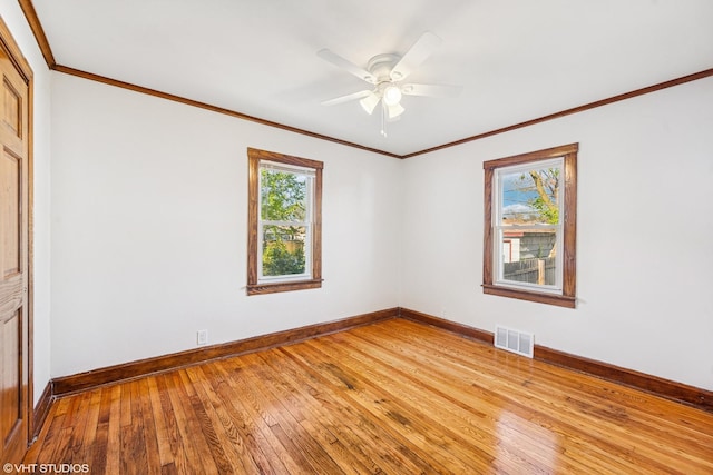 1633 S 18th Ave, Maywood, IL 60153 - spare room featuring light wood-type flooring, baseboards, ceiling fan, and crown molding