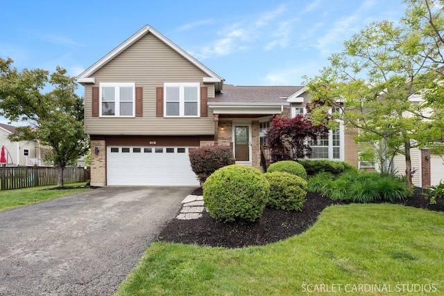 315 Churchill Ln, Aurora, IL 60504 - tri-level home featuring driveway, a garage, and brick siding