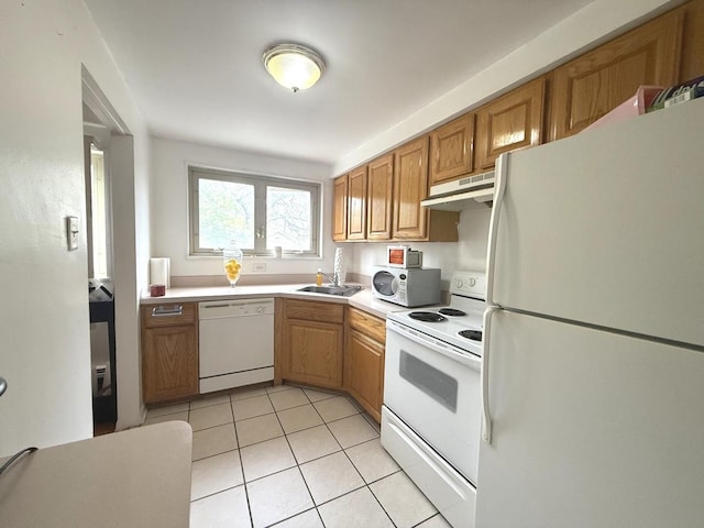 2014 W 111th St Unit 2N, Chicago, IL 60643 - kitchen with white appliances, under cabinet range hood, a sink, light tile patterned floors, and light countertops
