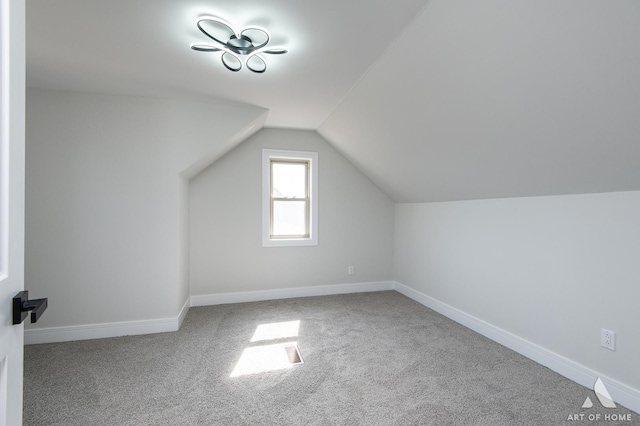 10925 Lyman Ave, Chicago Ridge, IL 60415 - additional living space featuring carpet flooring, vaulted ceiling, and baseboards