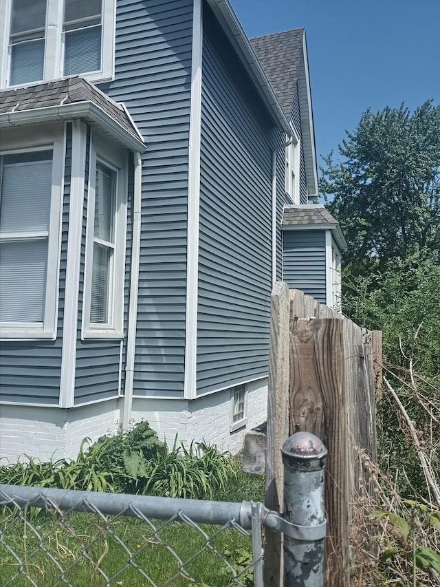 22 E 118th St, Chicago, IL 60628 - view of home's exterior featuring a shingled roof