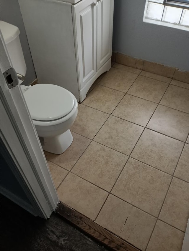 22 E 118th St, Chicago, IL 60628 - bathroom featuring tile patterned floors and toilet