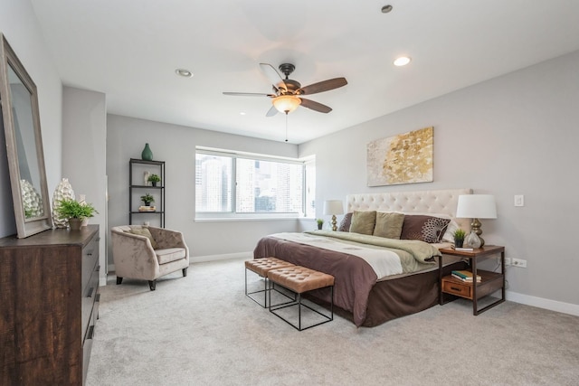 bedroom with light colored carpet, baseboards, ceiling fan, and recessed lighting
