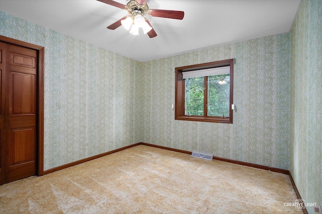 42W325 Jens Jensen Ln, Saint Charles, IL 60175 - spare room with wallpapered walls, carpet, a ceiling fan, and baseboards
