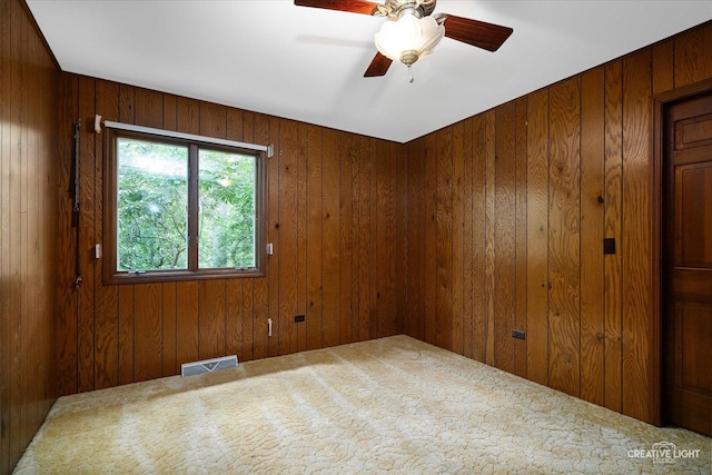 42W325 Jens Jensen Ln, Saint Charles, IL 60175 - unfurnished room with carpet, wood walls, and ceiling fan