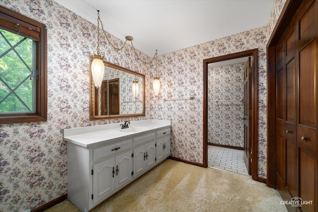 42W325 Jens Jensen Ln, Saint Charles, IL 60175 - bathroom with baseboards, vanity, and wallpapered walls