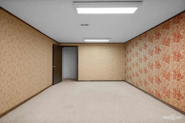 42W325 Jens Jensen Ln, Saint Charles, IL 60175 - unfurnished room featuring wallpapered walls, light carpet, crown molding, and baseboards