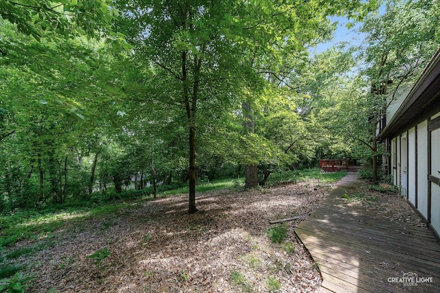 42W325 Jens Jensen Ln, Saint Charles, IL 60175 - view of yard with a wooden deck