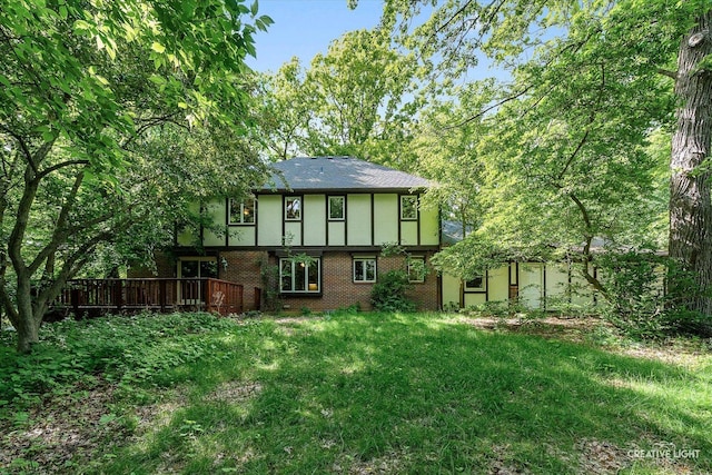 42W325 Jens Jensen Ln, Saint Charles, IL 60175 - rear view of house featuring brick siding, a deck, and stucco siding