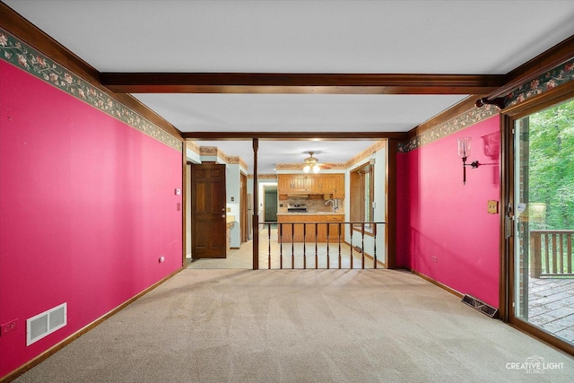 42W325 Jens Jensen Ln, Saint Charles, IL 60175 - spare room with carpet flooring, beamed ceiling, a ceiling fan, a sink, and crown molding
