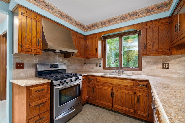 42W325 Jens Jensen Ln, Saint Charles, IL 60175 - kitchen featuring stainless steel gas range oven, a sink, custom range hood, and brown cabinets