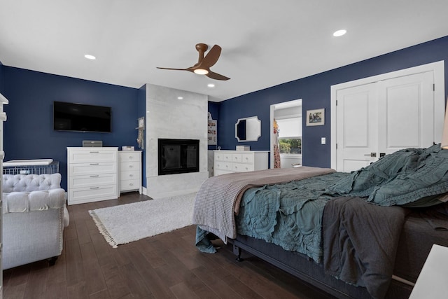 9543 Lorel Ave, Skokie, IL 60077 - bedroom with a premium fireplace, wood finished floors, ceiling fan, and recessed lighting