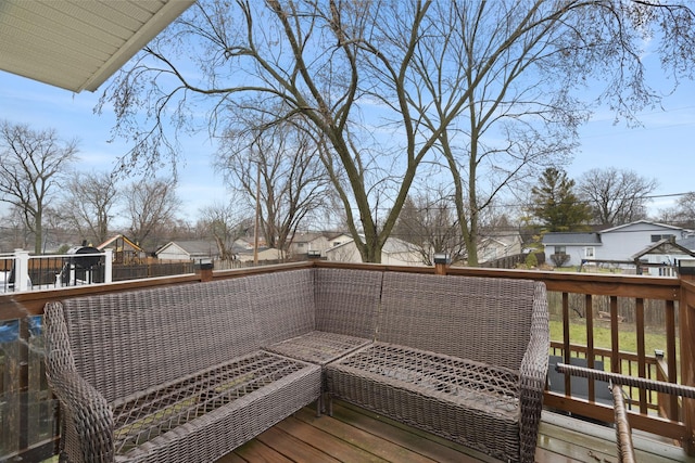 wooden deck featuring fence and a residential view