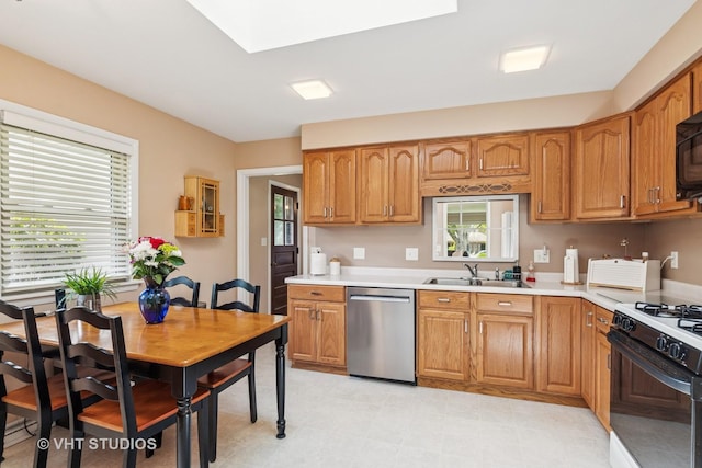 354 Richmond Ln, Lakewood, IL 60014 - kitchen featuring stainless steel dishwasher, gas stove, a sink, light countertops, and brown cabinetry