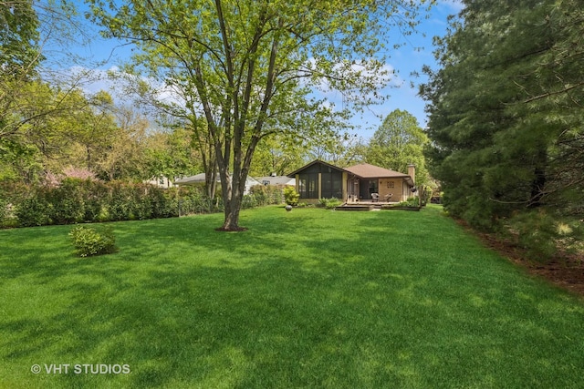 354 Richmond Ln, Lakewood, IL 60014 - view of green lawn featuring a sunroom