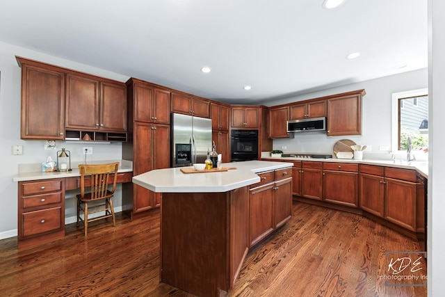 480 De Lasalle Ave, Naperville, IL 60565 - kitchen featuring stainless steel appliances, dark wood finished floors, light countertops, a kitchen island, and recessed lighting