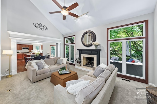 480 De Lasalle Ave, Naperville, IL 60565 - living room with high vaulted ceiling, a tile fireplace, baseboards, light carpet, and a ceiling fan