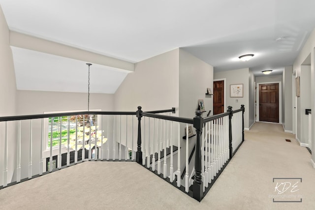 480 De Lasalle Ave, Naperville, IL 60565 - hall featuring carpet flooring, baseboards, vaulted ceiling, a chandelier, and an upstairs landing