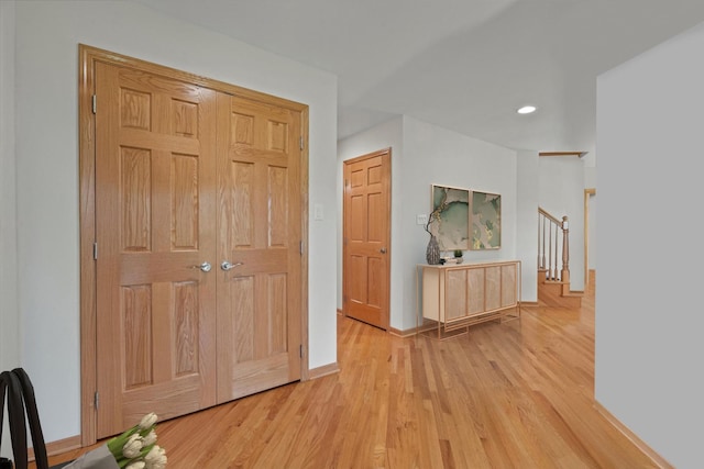 12195 Oxford Ct, Lemont, IL 60439 - hallway with light wood finished floors, baseboards, recessed lighting, and stairway